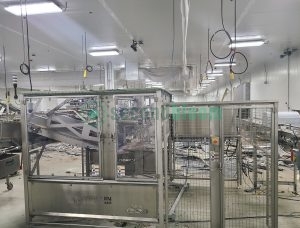 Viscon/Roopack automated harvesting system with stainless steel safety enclosure and wire mesh guarding in food processing facility